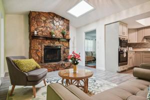 a living room with a couch and a fireplace at TRANQUILITY! PRIVATE Gated Estate! Boats, RVs OK! Has Separate Apt, Fishing, Hiking, LOW Rates! in Kissimmee