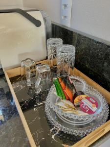 a table with wine glasses and a plate of food at Pousada Di Venezia - Hotel Fazenda in Nova Veneza