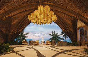 eine Lobby des Resorts mit einem Kronleuchter in der Unterkunft Secrets Playa Blanca Costa Mujeres - All Inclusive Adults Only in Cancún
