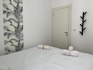 Ένα ή περισσότερα κρεβάτια σε δωμάτιο στο BreezHouse Sansa Urban Residence
