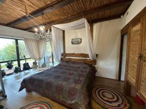 Postel nebo postele na pokoji v ubytování Chervona Kalyna Cottage + 37 fotografií