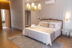Ένα ή περισσότερα κρεβάτια σε δωμάτιο στο Pousada e Cerimonial Itamaraty
