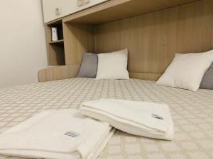 Postel nebo postele na pokoji v ubytování Il Cortiletto