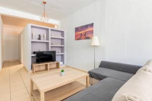 A television and/or entertainment centre at Seaside Escape Apartments - Apollon