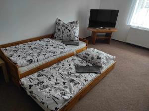 Postel nebo postele na pokoji v ubytování Apartmán Dobrá mysl
