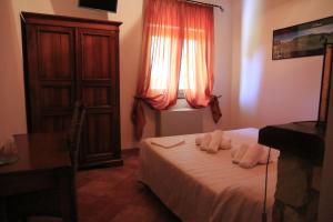 Letto o letti in una camera di Rifugio Fasanelli