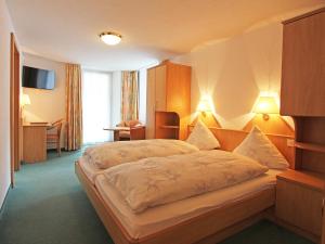 Кровать или кровати в номере Hotel Monte-Moro
