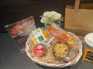 a basket filled with food on a table at Aerotel London Heathrow Airport, Terminal 2 & Terminal 3 in Hillingdon