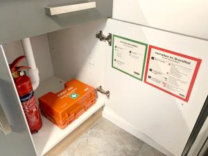 a refrigerator with an orange box inside of it at 21qm² Business Apartment in Bielefeld