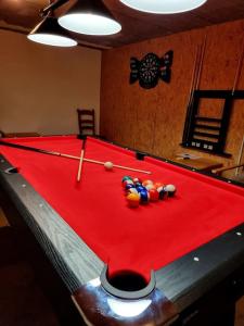 a pool table with balls on top of it at Domaine des oiseaux in Sapois