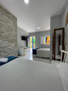 Postel nebo postele na pokoji v ubytování Pousada Girassol + 86 fotografií