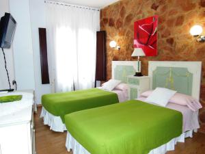 Cama o camas de una habitación en Casa Rural Jardín del Desierto