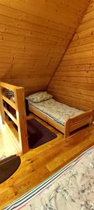 a room with two bunk beds in a attic at Złote Piaski Mielenko in Mielenko