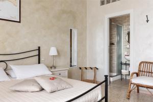 Postel nebo postele na pokoji v ubytování La dimora di Caboto B&B