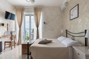 Postel nebo postele na pokoji v ubytování La dimora di Caboto B&B