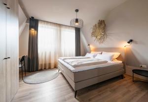 Ένα ή περισσότερα κρεβάτια σε δωμάτιο στο Appartementhotel Seeblick
