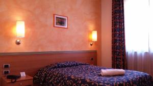 Postel nebo postele na pokoji v ubytování Palace Hotel Due Ponti