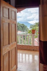 an open door with a view of a balcony at Hotel & Restaurante Hanna Resort in Panajachel