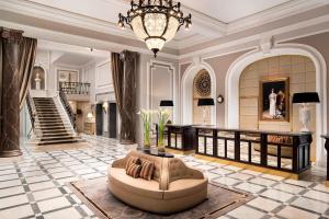a large lobby with a couch in the middle at Hotel Maria Cristina, a Luxury Collection Hotel, San Sebastian in San Sebastián