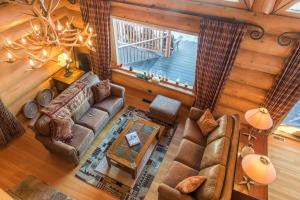 an overhead view of a living room with a couch at Revelstoke House Luxury Log House at Base of Resort in Revelstoke