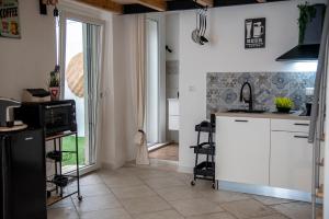 a kitchen with a sink and a counter top at Asmara exclusive "Loft industrial" in Brindisi