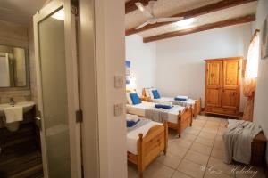 A bed or beds in a room at Orchidea Xaghra