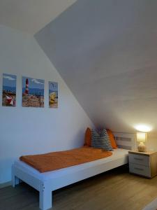 Llit o llits en una habitació de Ferienwohnung Jägerstüble