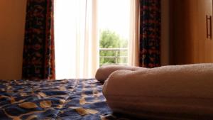 Postel nebo postele na pokoji v ubytování Palace Hotel Due Ponti