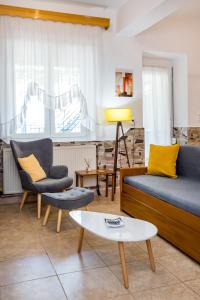 Posedenie v ubytovaní Golden Sunset Beach Apartment