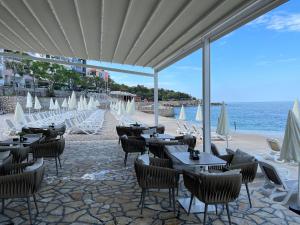 a restaurant on the beach with tables and chairs at Villa Sunshine in Bar