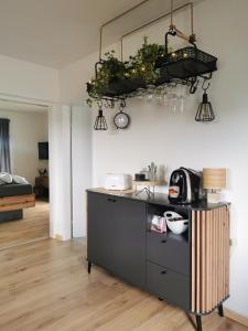 a kitchen with a counter top and a room at Pine View 