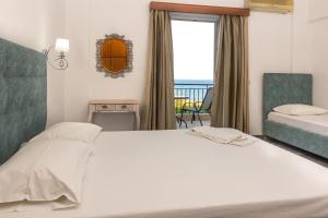 Ένα ή περισσότερα κρεβάτια σε δωμάτιο στο Seaheaven houses A4