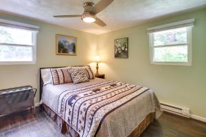 a bedroom with a bed and a ceiling fan at Eagle Rock Cottage Cozy Creekside Getaway with Deck in Eagle Rock