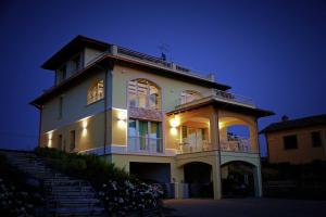 a large white building with a balcony on top of it at Agriturismo BioCore 2 - Colledoro in Giulianova