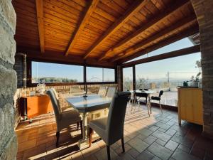 a patio with a table and chairs on a deck at Agriturismo BioCore 2 - Colledoro in Giulianova