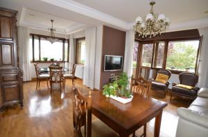 a living room with a table and a dining room at B&B Zaldu in Estella