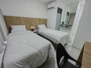 Postel nebo postele na pokoji v ubytování Go Inn Aracruz
