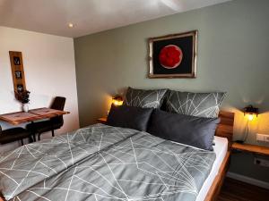a bedroom with a bed and a table with a table at Am Berg in Feldberg +85 photos