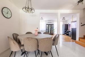 a dining room with a table and chairs at Villa Andrea in Koper