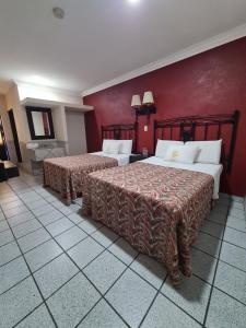 En eller flere senger på et rom på Hotel TorreBlanca