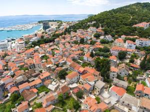 an aerial view of a city with houses and the ocean at Apartment Corner in Split