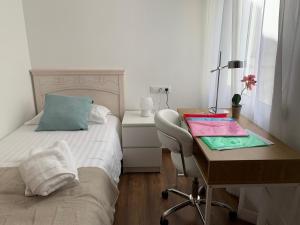 Postel nebo postele na pokoji v ubytování Sueca 1