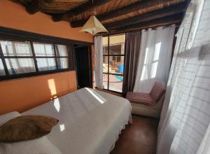 Ліжко або ліжка в номері HOTEL RINCÓN MAGICO REAL DE CATORCE