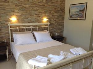 Postel nebo postele na pokoji v ubytování Villa Agapi