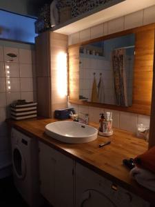 a bathroom counter with a sink and a mirror at Beautiful apartment in the heart of Reykjavik in Reykjavík