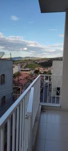 a balcony with a view of a city at Hospedagem Quarto Chic centro Cunha in Cunha