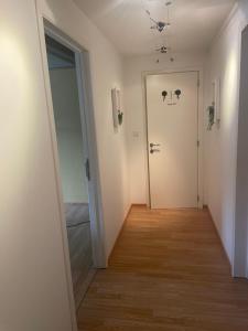 a hallway with a door with a face drawn on it at au 39 in Jalhay
