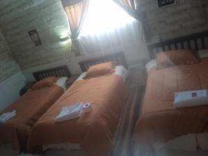 Кровать или кровати в номере Hostal Cabaña Blanca