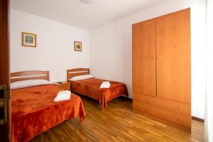 Postel nebo postele na pokoji v ubytování Yani's Hospedaje Pension 1 estrella