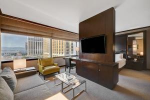 a living room with a couch and a tv at Vdara Hotel & Spa in Las Vegas